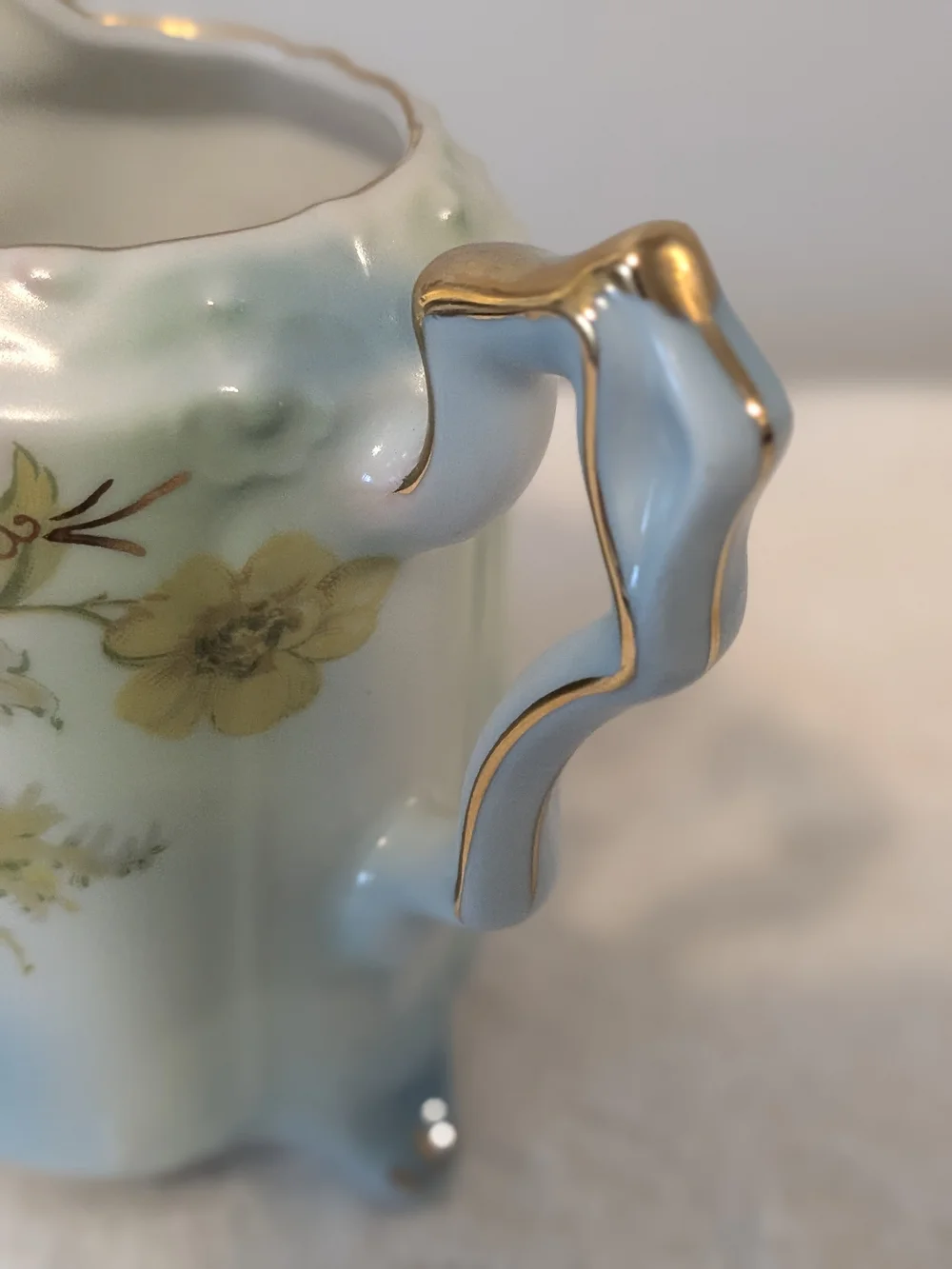 Antique Porcelain Footed Creamer R. S. Prussia Floral Design Trimmed In Gold.